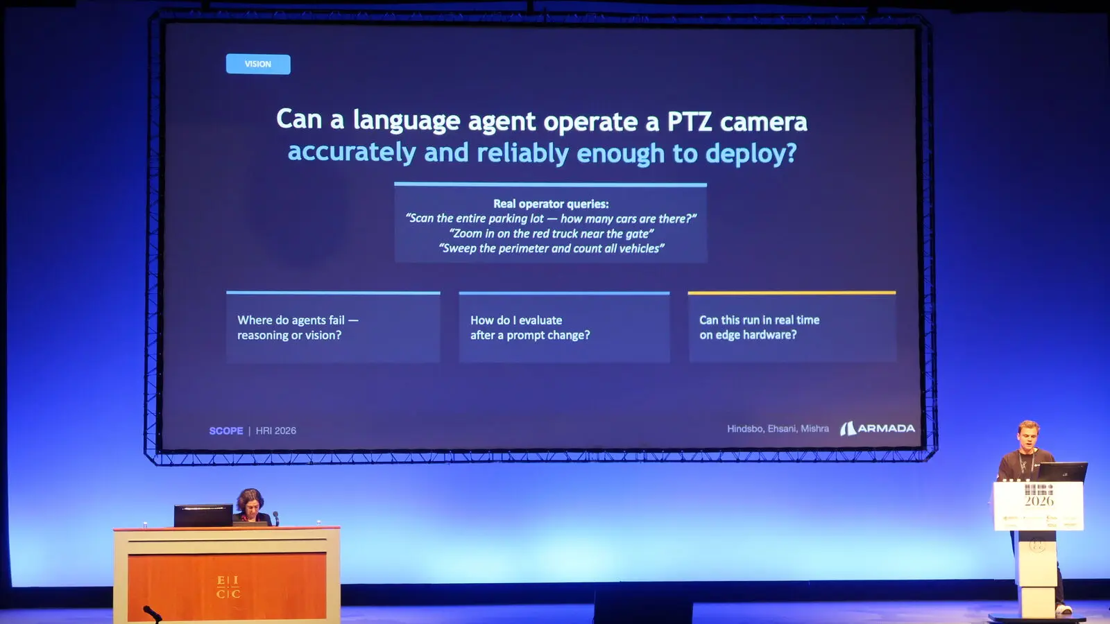 Nikolaj Hindsbo speaking beside a slide about PTZ camera agents